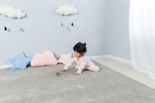 Children playing on a carpet area